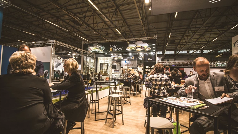 People Inside a Cafe With Tables and Chairs