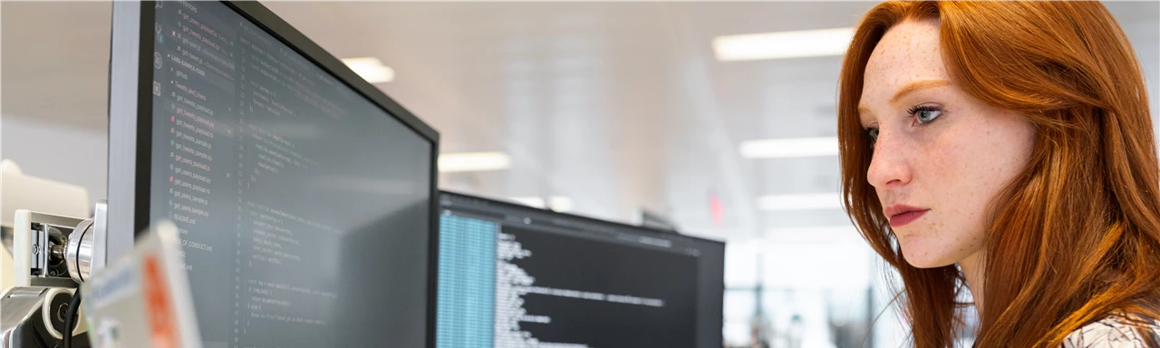 Woman Coding on Computer