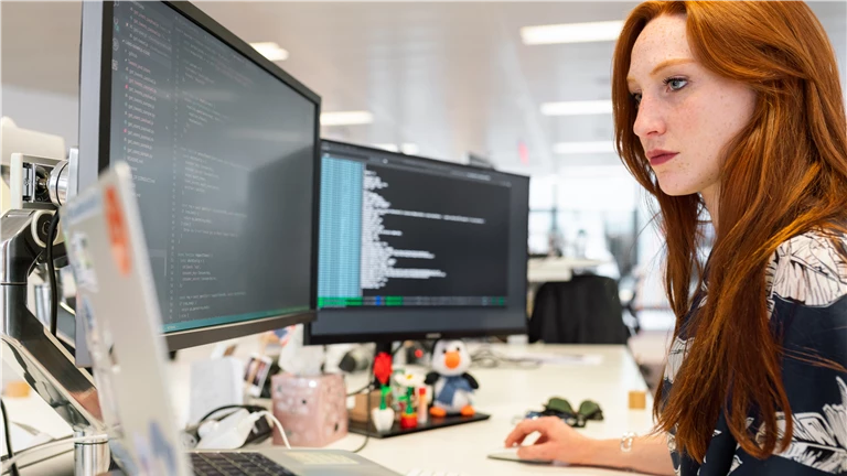 Woman Coding on Computer