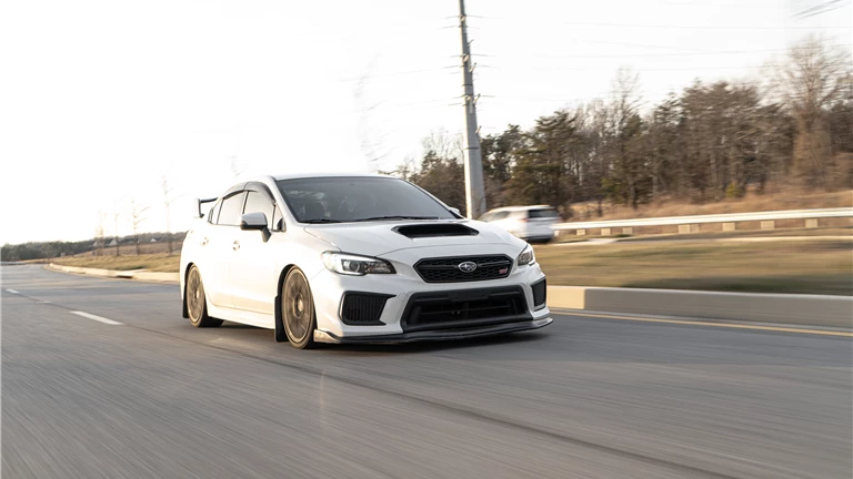 White Subaru Impreza on Road