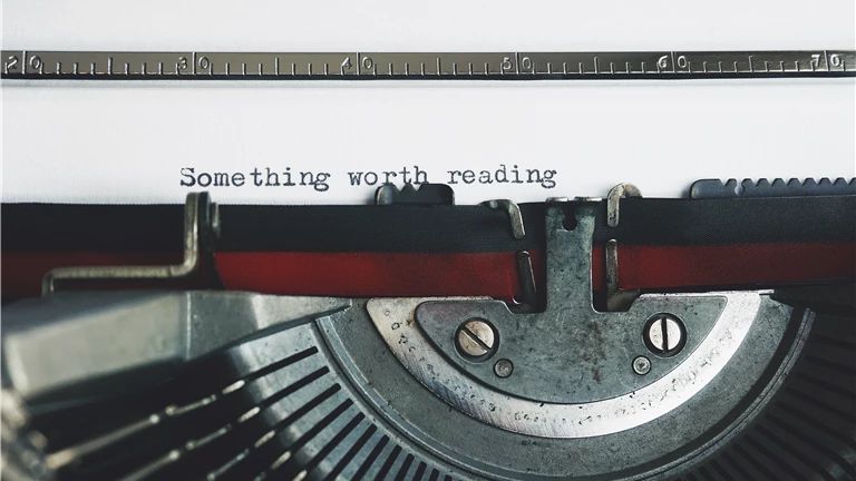 Black and Red Typewriter on White Table