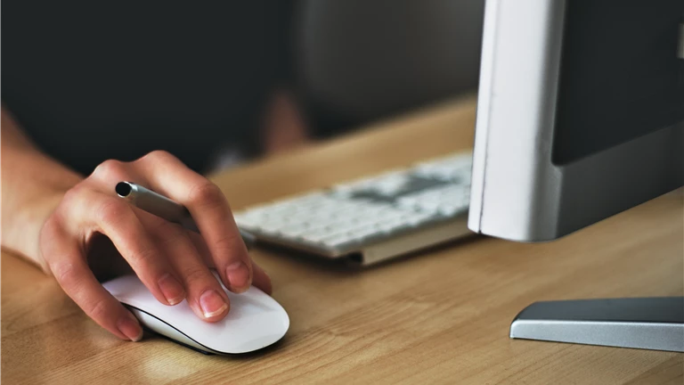 Person Holding Apple Magic Mouse