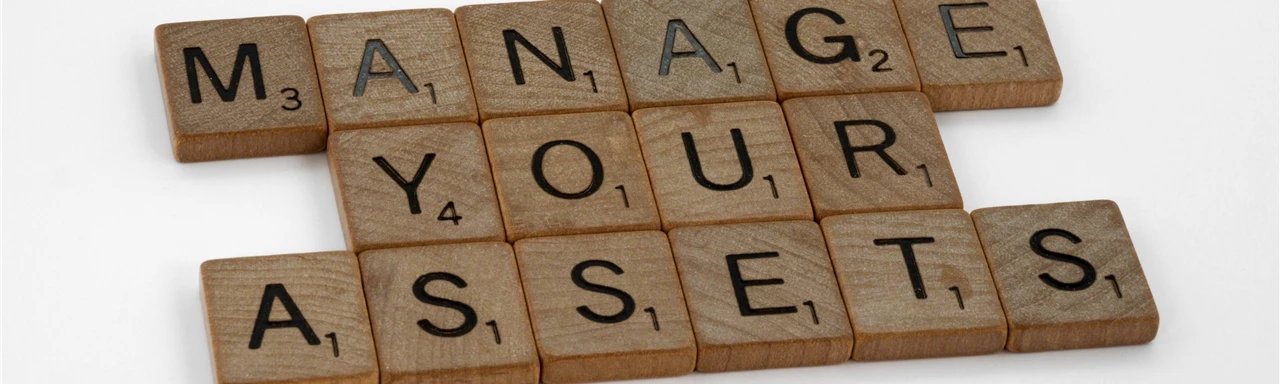 Close-Up Shot of Scrabble Tiles on a White Surface